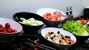 A variety of food bowls on a table.