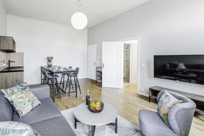 Deluxe Apartment | Living area | 42-inch LCD TV with digital channels