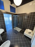 Standard Suite | Bathroom | Free toiletries, hair dryer, bathrobes, slippers