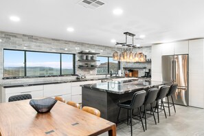 Enjoy cooking with a view from the kitchen's large island and windows.