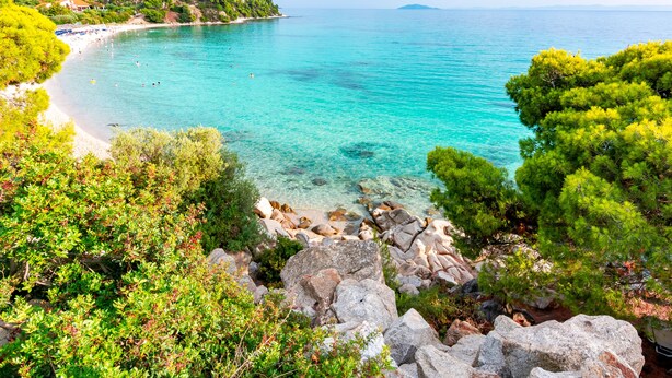 A coastal landscape with clear turquoise waters, rocky shorelines, and lush greenery. - Sanders Tower Centre - Homey Studio w/ Balcony (Thessaloniki)