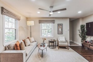 Signature House, 2 Bedrooms, Kitchen, Courtyard View | Living room | 75-inch Smart TV with digital channels, video-game console, Netflix - Garden District Duplex (Baton Rouge)