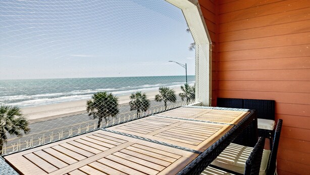 A balcony with a view of the beach and ocean. - Elegant Beach Condo, Amazing Ocean Views, W/D (Galveston)