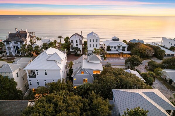 A coastal residential area with houses featuring gabled roofs and a mix of architectural styles. - Wave on Wave|Easy Beach Access|Private Pool|Gulf Views|Directly on 30A (Santa Rosa Beach)
