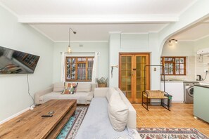 Basic House | Living area | TV - Beachside 2BD Home in the Heart of Sea Point! (Cape Town)