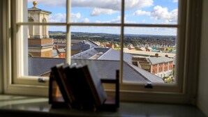 A view through a window with a book on a windowsill. - The Duchess of Cornwall Inn (Dorchester)