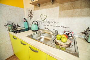 Fridge, microwave, stovetop, coffee/tea maker