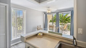 A bathroom with a large window, a sink, and a towel rack. - SPC 1030 is a 1 BR that sleeps 4 with beach access (Destin)