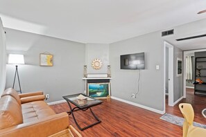 Smart TV, fireplace, books, offices