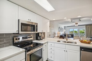 Fridge, microwave, stovetop, coffee/tea maker