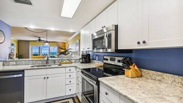 Fridge, microwave, stovetop, coffee/tea maker