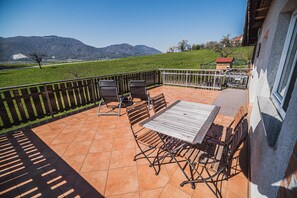 Enjoy al fresco dining on the patio with a barbecue grill and comfortable seating.