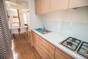 Fridge, microwave, stovetop, cookware/dishes/utensils