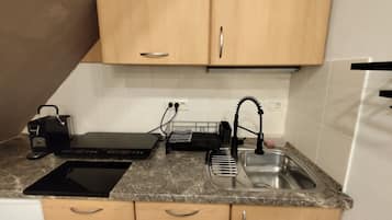 Fridge, stovetop, coffee/tea maker, cookware/dishes/utensils