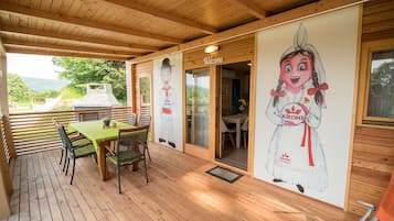 Relax and socialize in this inviting outdoor space with a dining table and comfortable seating.