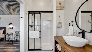 Shower, hair dryer, towels, shampoo