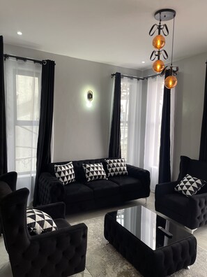 Living area - Perfect, Relaxing, Queen Bed Suites W/ Free Wi-Fi, Free Parking & 24Hr Security. (Kampala)