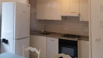 Apartment | Private kitchen | Full-sized fridge, oven, electric kettle, toaster