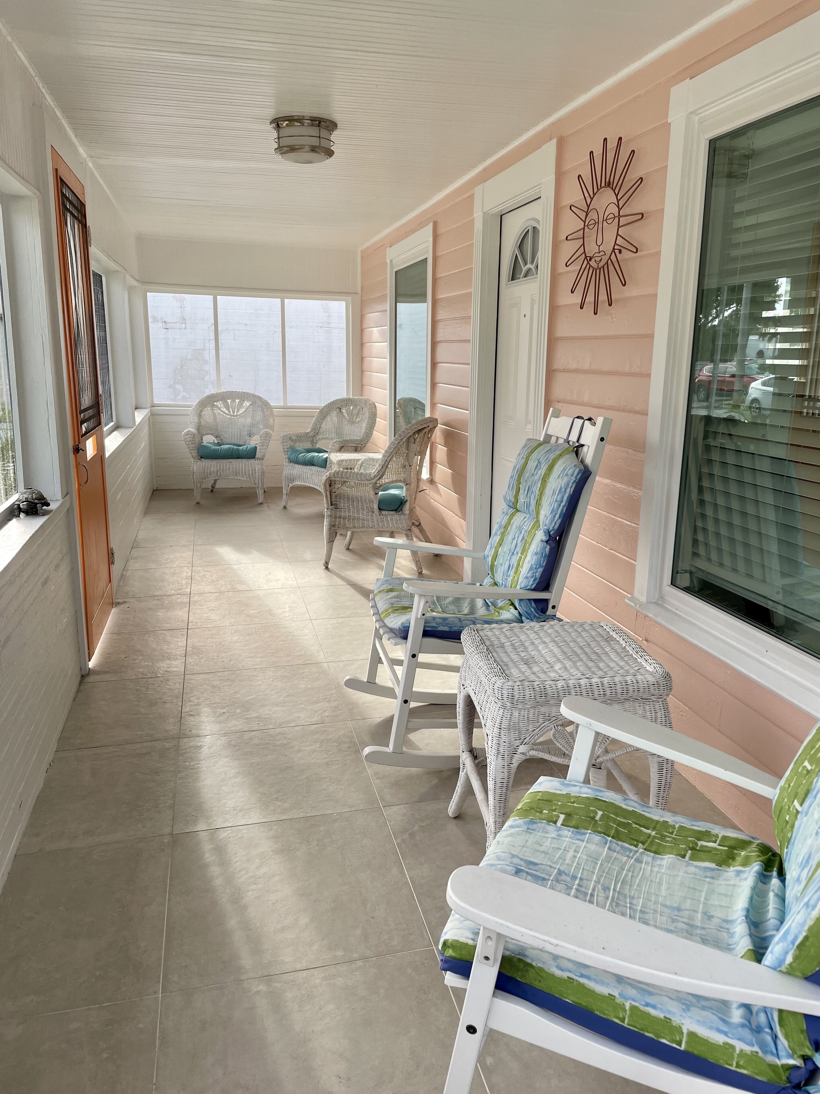 Screened in porch to watch walkers by