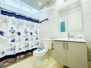 Shower, hair dryer, towels, soap