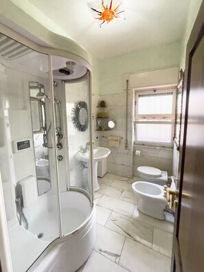 Shower, eco-friendly toiletries, hair dryer, bidet