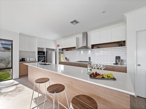 Fridge, microwave, oven, stovetop - Mariners Cove Luxury Canal Home (Dudley Park)