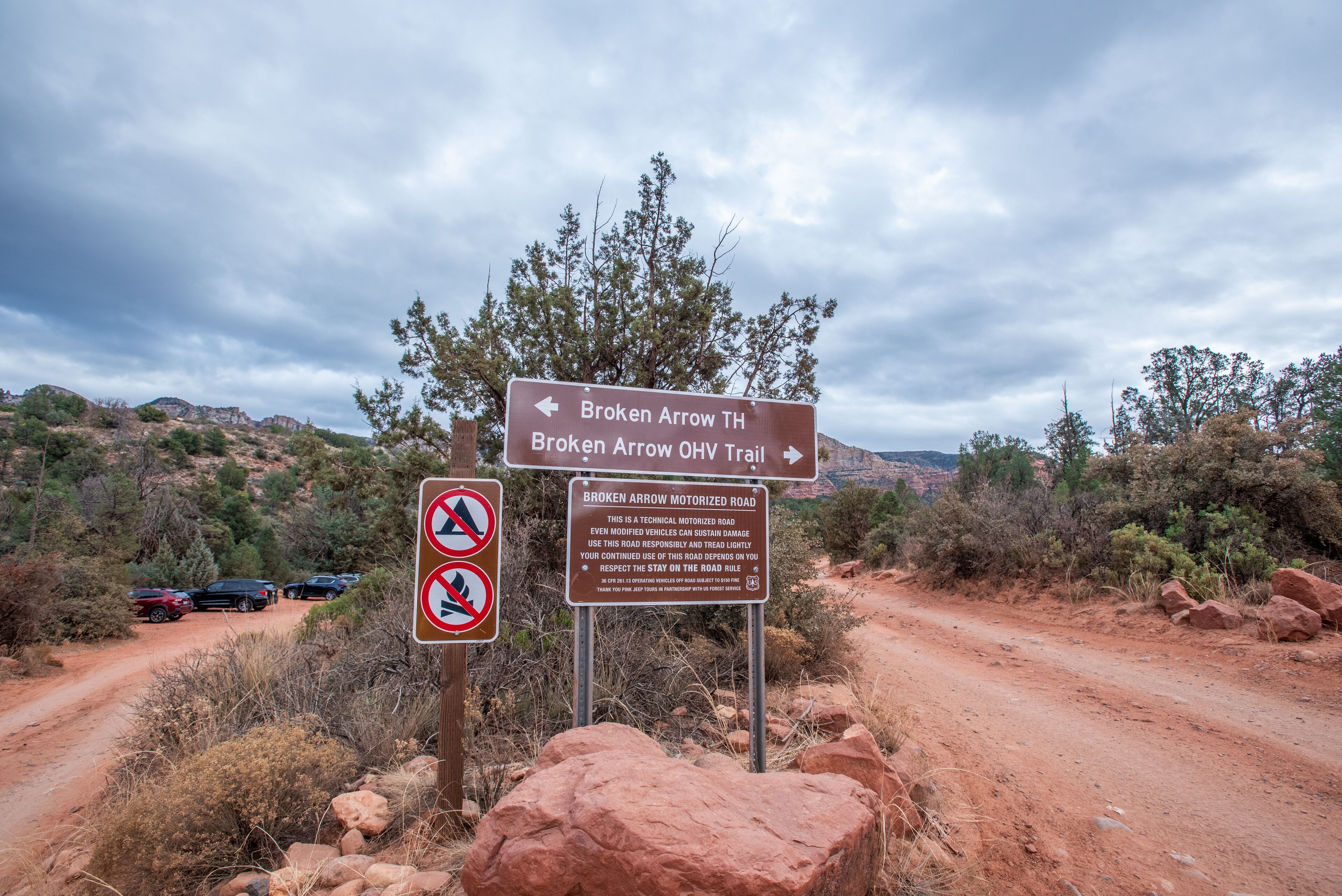 A sign for the Broken Arrow Trail with a motorized road warning.
