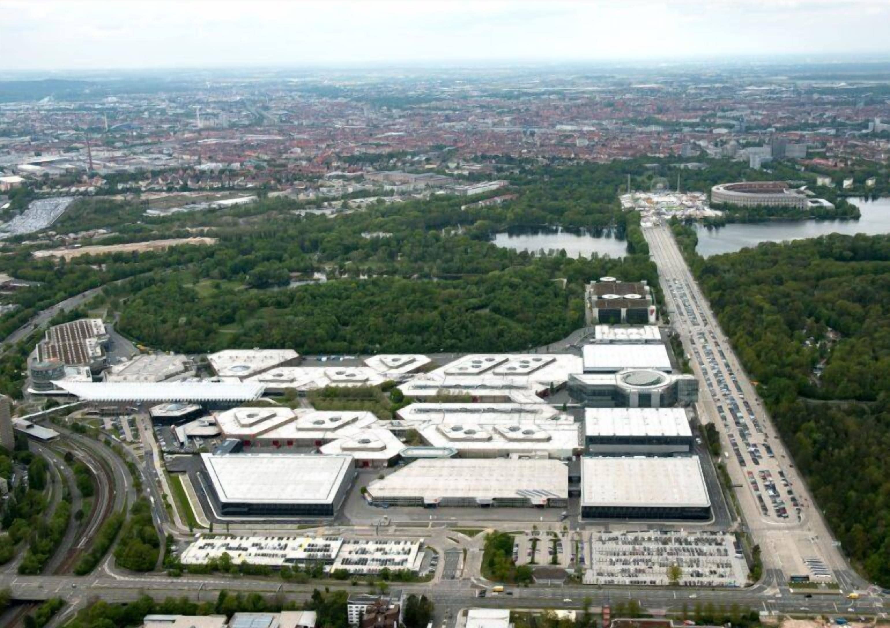 An industrial area with large warehouses and a parking lot.