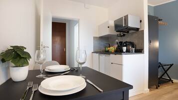 Fridge, microwave, stovetop, coffee/tea maker