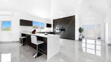 Villa | Private kitchen | Fridge, microwave, oven, stovetop