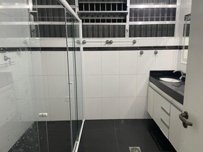 Shower, hair dryer, soap, toilet paper