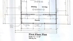 Plattegrond van de eerste verdieping van een gebouw van 89 meter kwadraat, met een hoofdslaapkamer, slaapkamer 2, hal, badkamer, eetkamer, woonkamer en veranda.