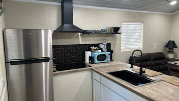 Fridge, microwave, stovetop, coffee/tea maker
