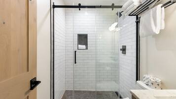 Shower, hair dryer, towels, shampoo