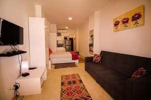 TV - Turtles Beach Resort GP2 Studio with Terrace (Al Ahyaa near Alwaleed Ben Talaal palace)