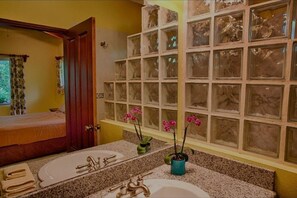 A bathroom with two sinks, a mirror, and a window with decorative glass panels. - Henton Hacienda ,fiv minutes drive from the beach. (Los Pargos)