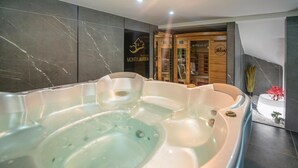 A spa area with a hot tub, wooden cabinets, and a sign for 'MONTIS AUREA'.