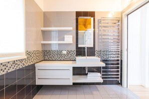 Shower - GuestHost - Travel with your family and friends and explore lakes and mountains near Como!This large attic, with two bedrooms, two bathrooms, open space kitchen with island, large living room, terraces and patio for relaxing, is located on the road that  (Cesana Brianza)