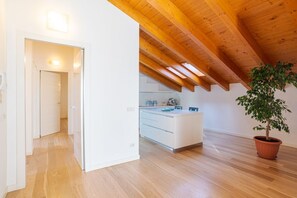 Interior - GuestHost - Travel with your family and friends and explore lakes and mountains near Como!This large attic, with two bedrooms, two bathrooms, open space kitchen with island, large living room, terraces and patio for relaxing, is located on the road that  (Cesana Brianza)