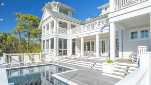 A large, multi-story house with a swimming pool, outdoor seating, and a balcony. - Gulf Bridge by Stay on 30a (Inlet Beach)