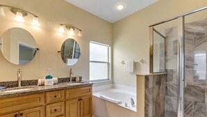 A bathroom with a large vanity, a bathtub, and a walk-in shower. - 2 Suites, 1 King, 5 Beds: Pool. Games Room #810 (Davenport)