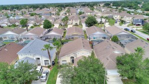 A residential area with multiple houses, some with attached garages and visible driveways. - 2 Suites, 1 King, 5 Beds: Pool. Games Room #810 (Davenport)