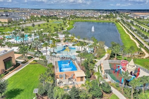 A resort with a swimming pool, water park, and a lake view.