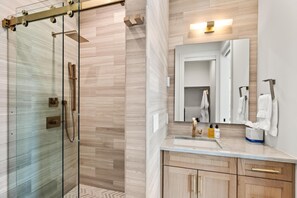 Shower, hair dryer, towels, shampoo