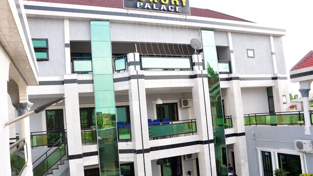 A multi-story building with a sign reading "Luxury Palace". - Luxury Palace (Lomé)