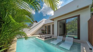A modern house with a swimming pool, a staircase, and a large glass door. - Dreamscape Haven  (Canggu)