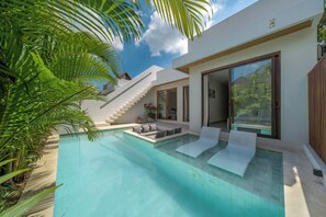 A modern house with a swimming pool, a staircase, and a large glass door. - Dreamscape Haven  (Canggu)