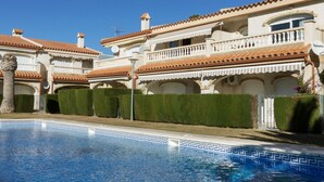 A large, multi-story building with a swimming pool in the foreground. - Miami Dorada II by Interhome (Miami Platja)