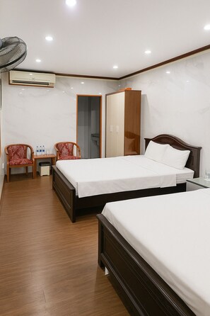 Family Room | 1 bedroom, in-room safe, desk, blackout curtains
