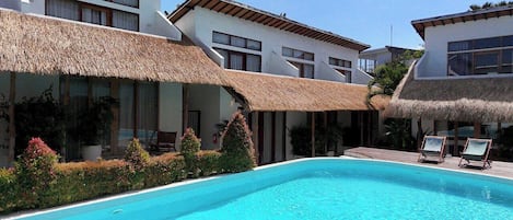 Outdoor pool, pool umbrellas, pool loungers